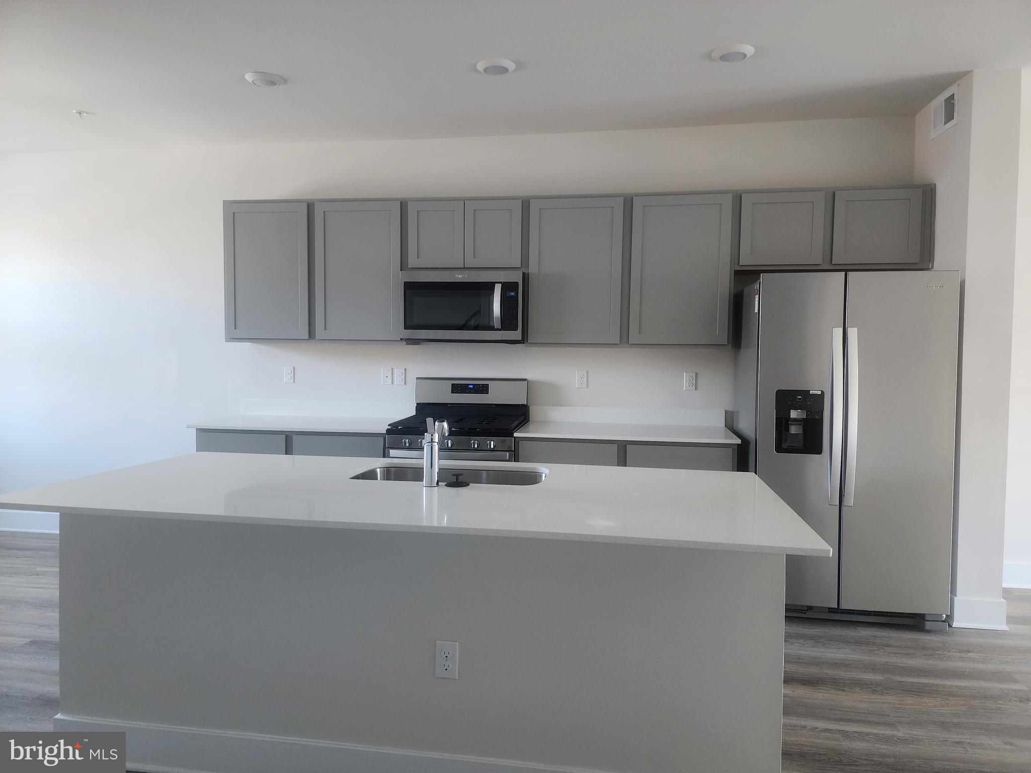 231 Joppa Farm Road Joppa, MD 21085 - Photo 6 of 25 a kitchen with appliances a sink and cabinets