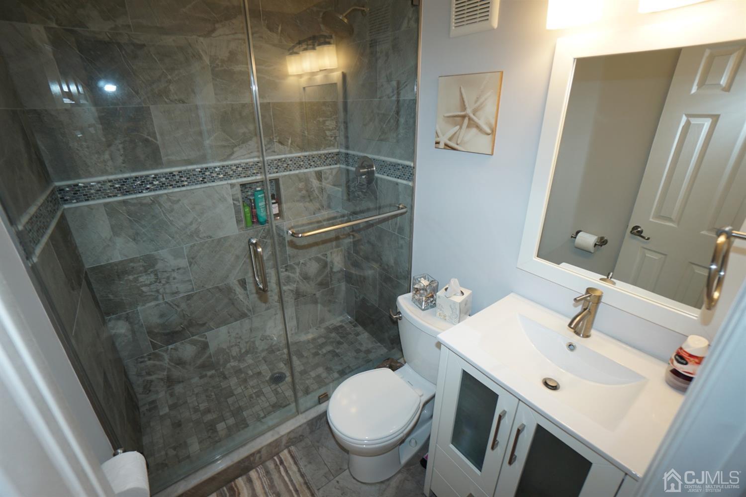 124 East Cliff Road Colonia, NJ 07067 - Photo 22 of 31 a bathroom with a sink toilet and shower