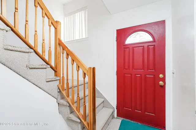 a kitchen with a stove a refrigerator and a sink