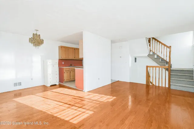 a kitchen with a stove a sink and a microwave
