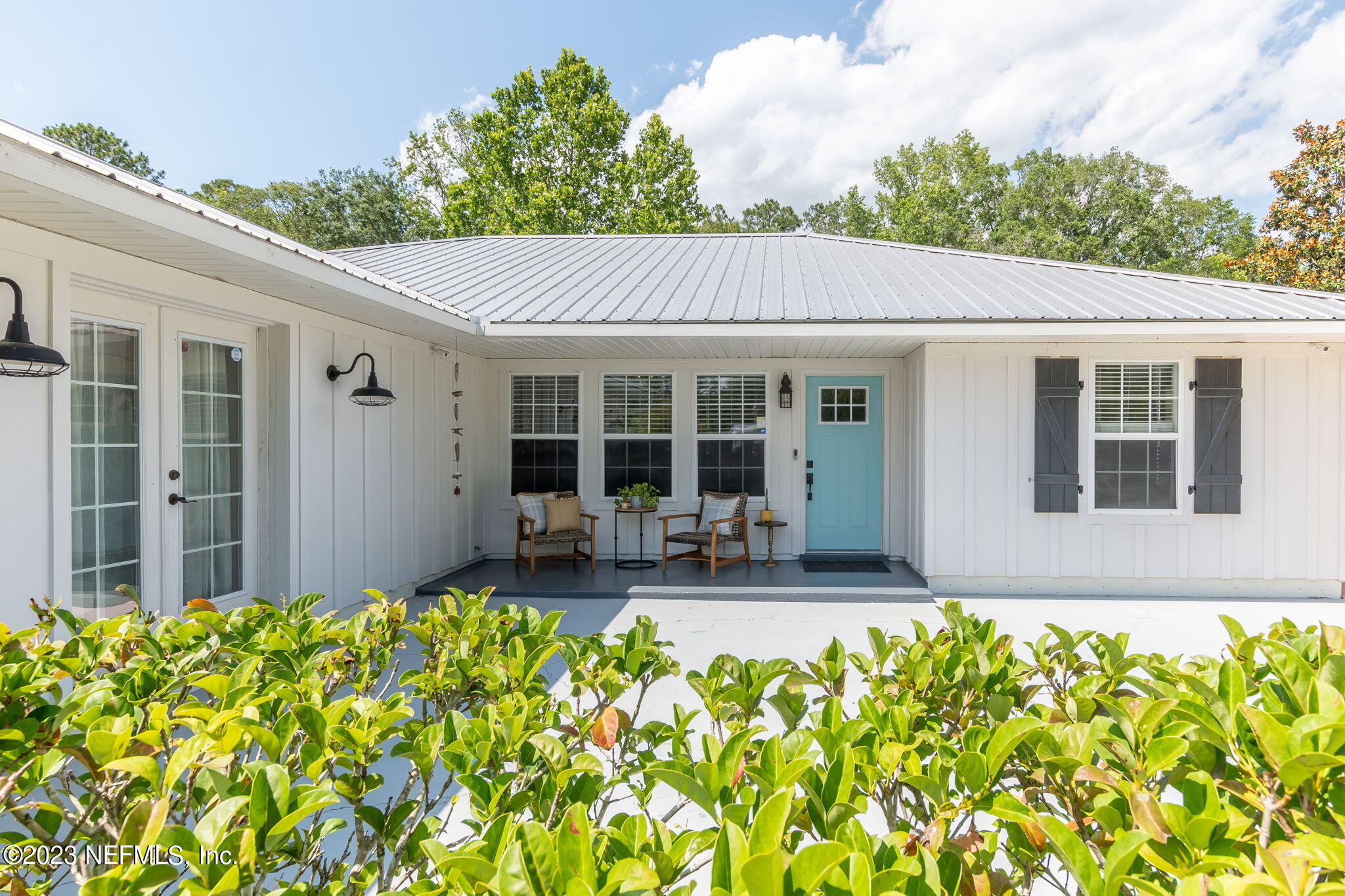 5150 Scaff Road St. Augustine, FL 32092 - Photo 1 of 61 a front view of a house with patio and garden