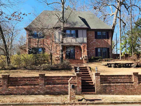 a view of a hallway view with wooden floor and staircase