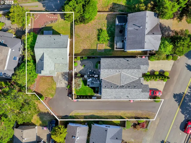 an aerial view of house with yard