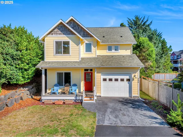 a view of house with swimming pool and glass windows