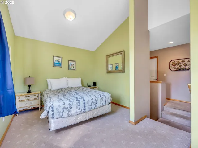 a bedroom with a bed and a view of bathroom