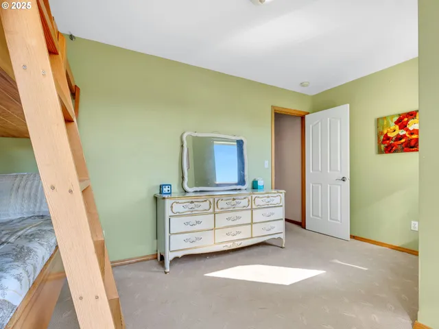 a bedroom with a bed and a furniture