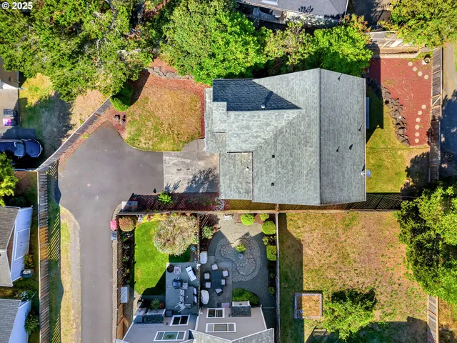 an aerial view of a house with outdoor space