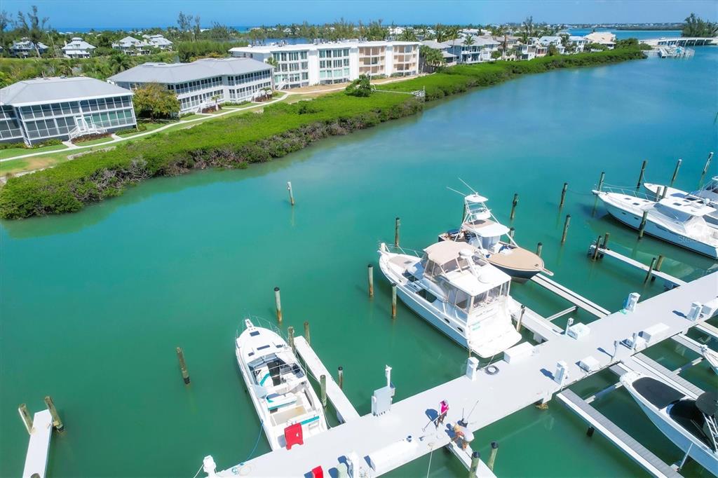 5820 Gasparilla Road, Unit SLIP #49 Boca Grande, FL 33921 - Photo 11 of 18 an aerial view of a house with outdoor space pool seating area and yard