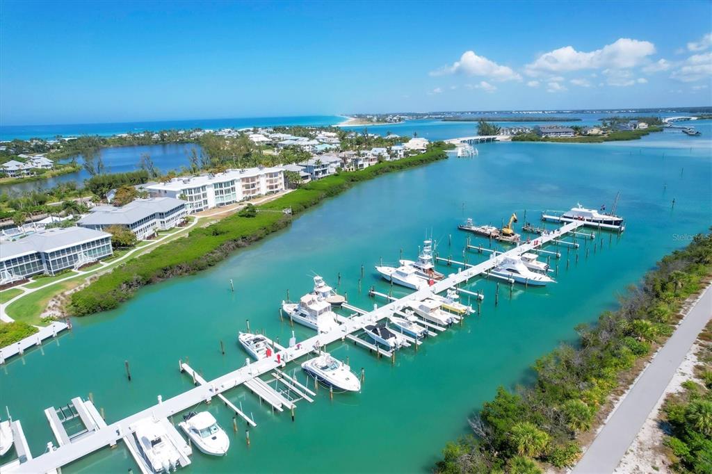 5820 Gasparilla Road, Unit SLIP #49 Boca Grande, FL 33921 - Photo 15 of 18 an aerial view of a houses with a lake view