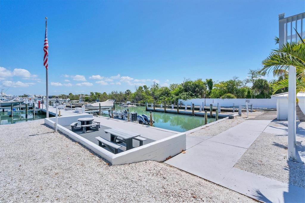 5820 Gasparilla Road, Unit SLIP #49 Boca Grande, FL 33921 - Photo 5 of 18 a view of a terrace with sitting area