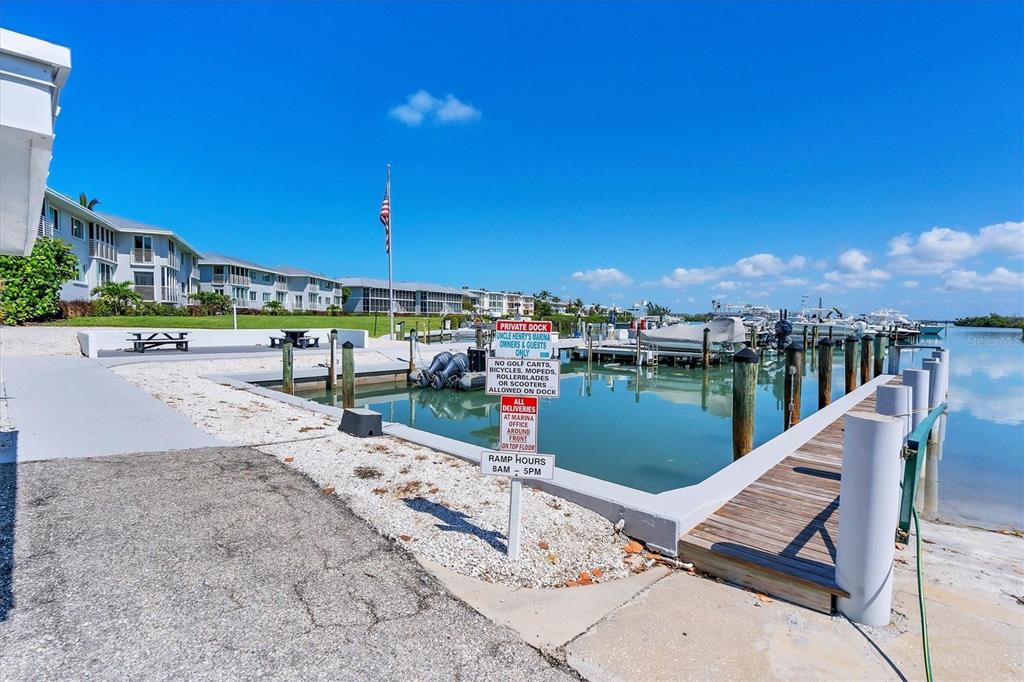 5820 Gasparilla Road, Unit SLIP #49 Boca Grande, FL 33921 - Photo 6 of 18 a view of a lake with a outdoor space