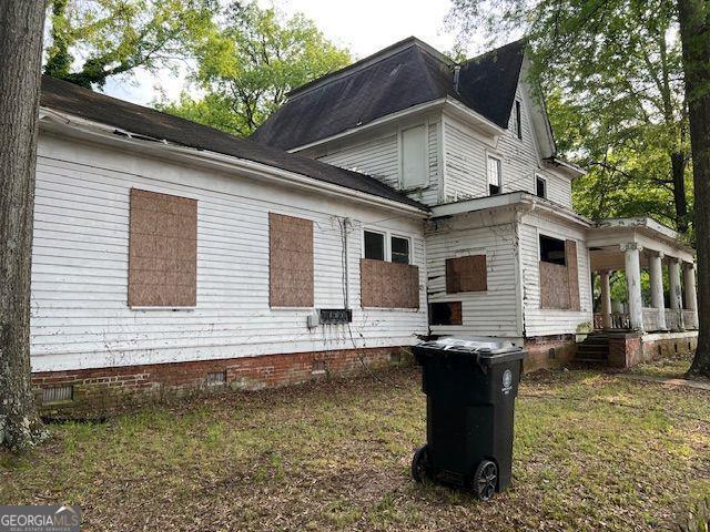 801 Maple Avenue Southwest Rome, GA 30161 - Photo 2 of 3 a backyard of a house with barbeque oven table and chairs