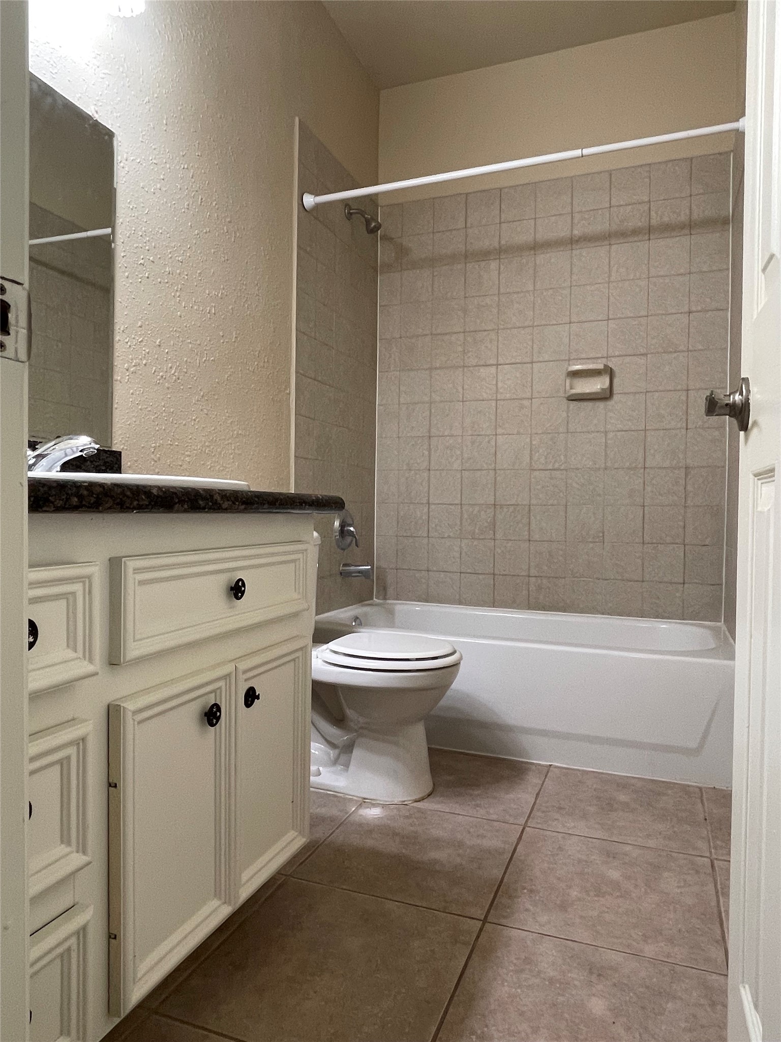 10607 Mills Way Houston, TX 77070 - Photo 11 of 17 a bathroom with a toilet and a shower