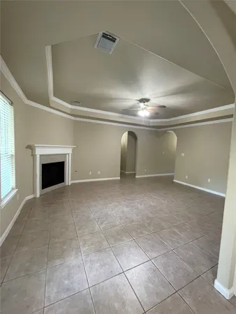 a view of an empty room with a fireplace