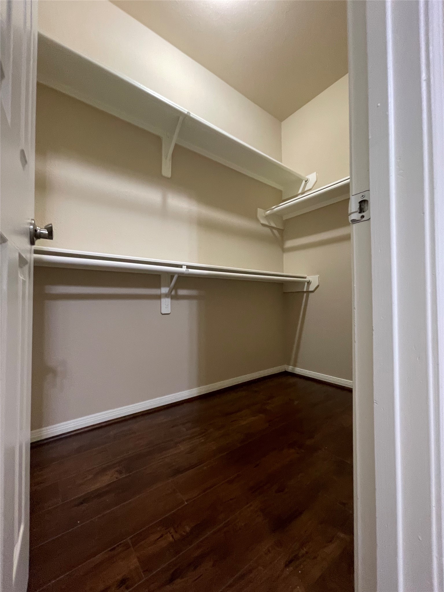 10607 Mills Way Houston, TX 77070 - Photo 10 of 17 a view of an empty room with wooden floor