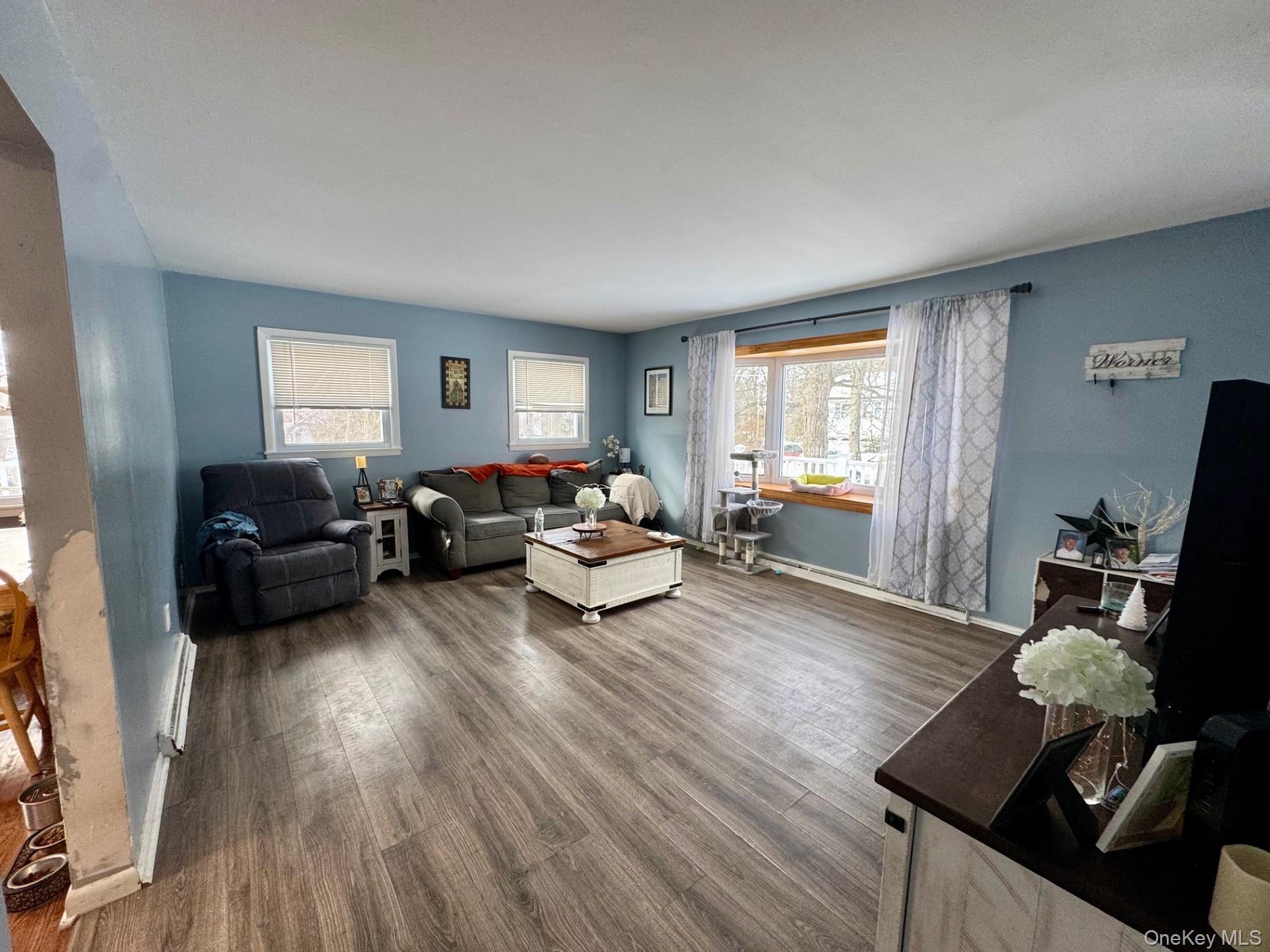 10 Maplewood Road Highland Mills, NY 10930 - Photo 2 of 9 a living room with furniture and wooden floor