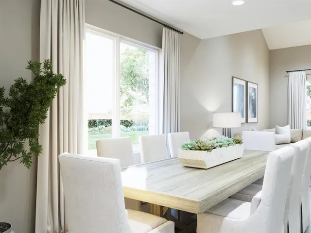 a kitchen with stainless steel appliances granite countertop a kitchen island hardwood floor sink and stove