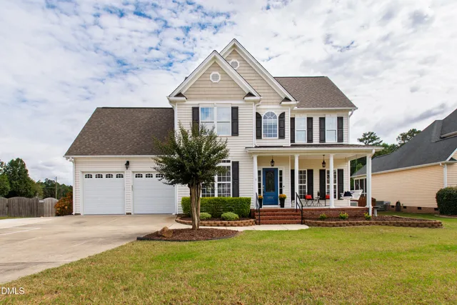 front view of a house with a yard