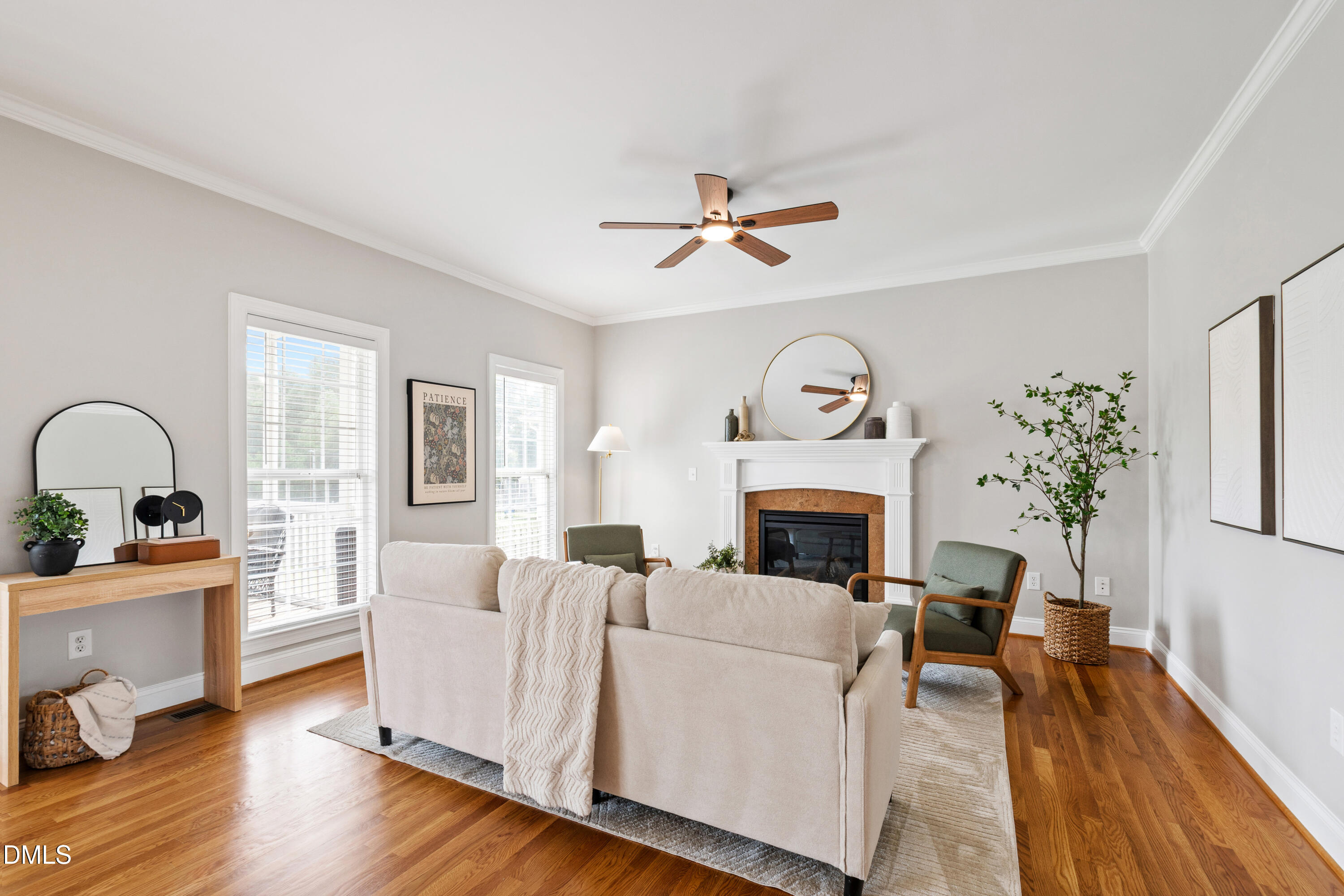 7753 Pegram Street Willow Spring, NC 27592 - Photo 23 of 54 a living room with furniture a fireplace and wooden floor