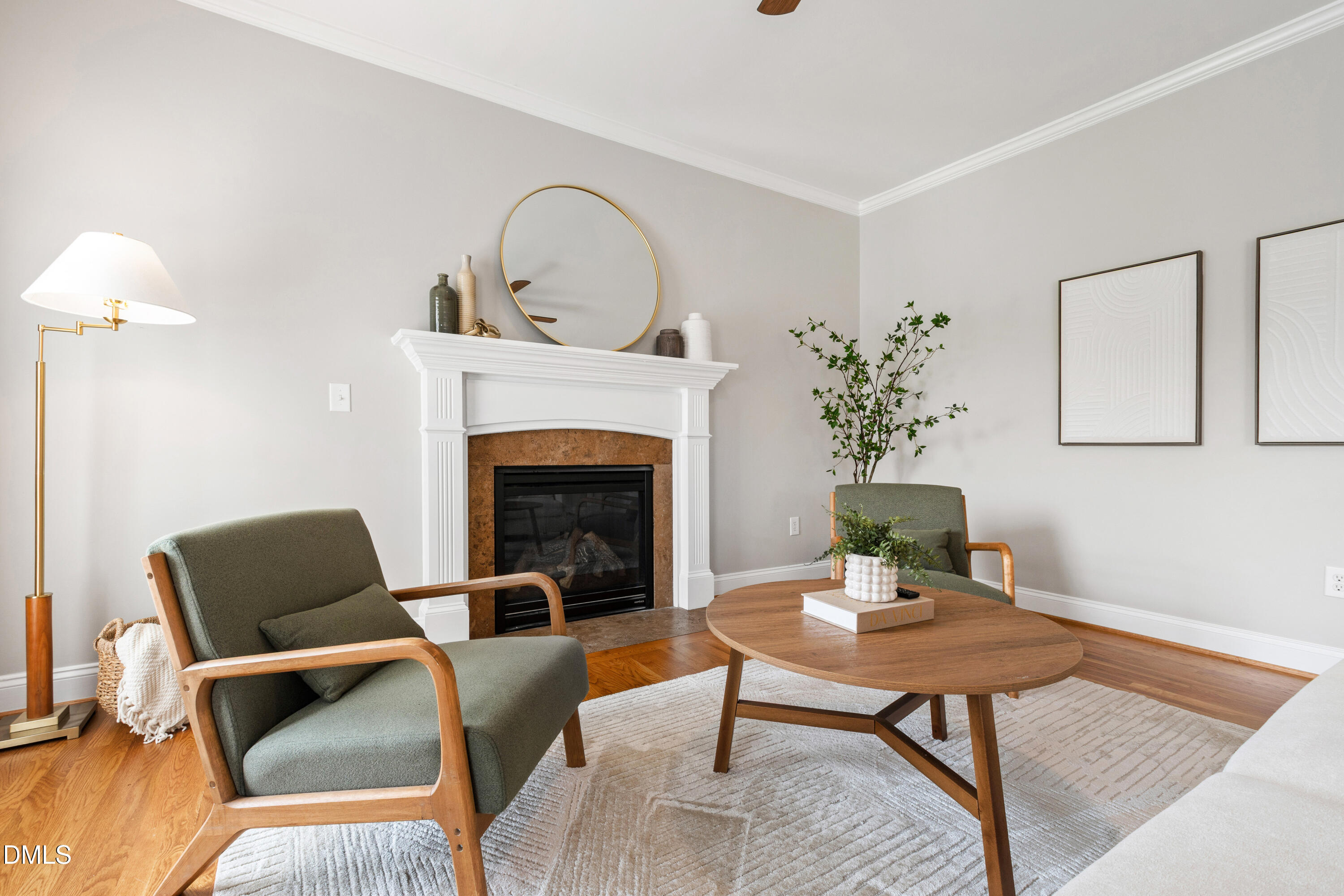 7753 Pegram Street Willow Spring, NC 27592 - Photo 25 of 54 a living room with furniture a table and a fireplace