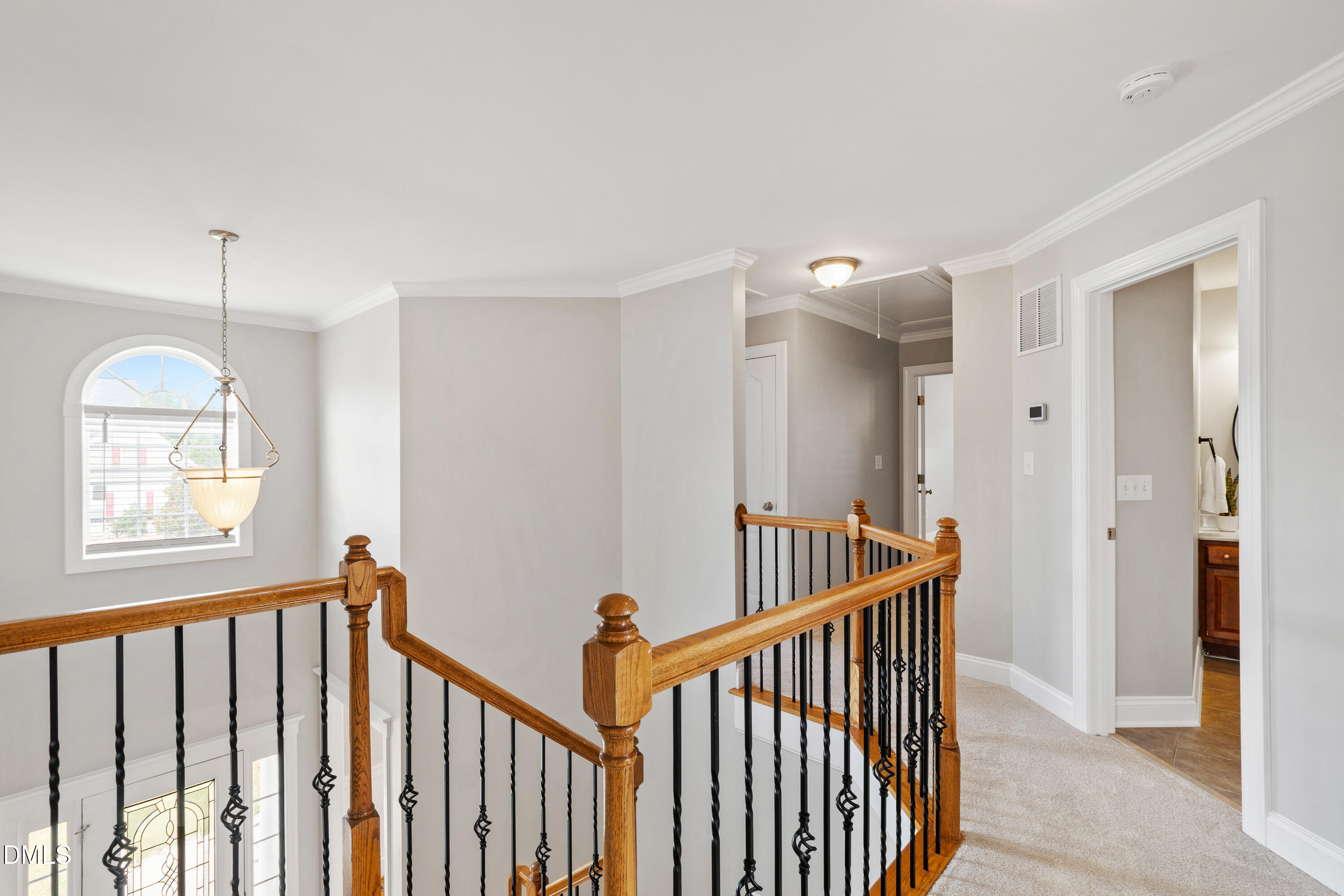 7753 Pegram Street Willow Spring, NC 27592 - Photo 27 of 54 a view of a hallway with windows and stairs