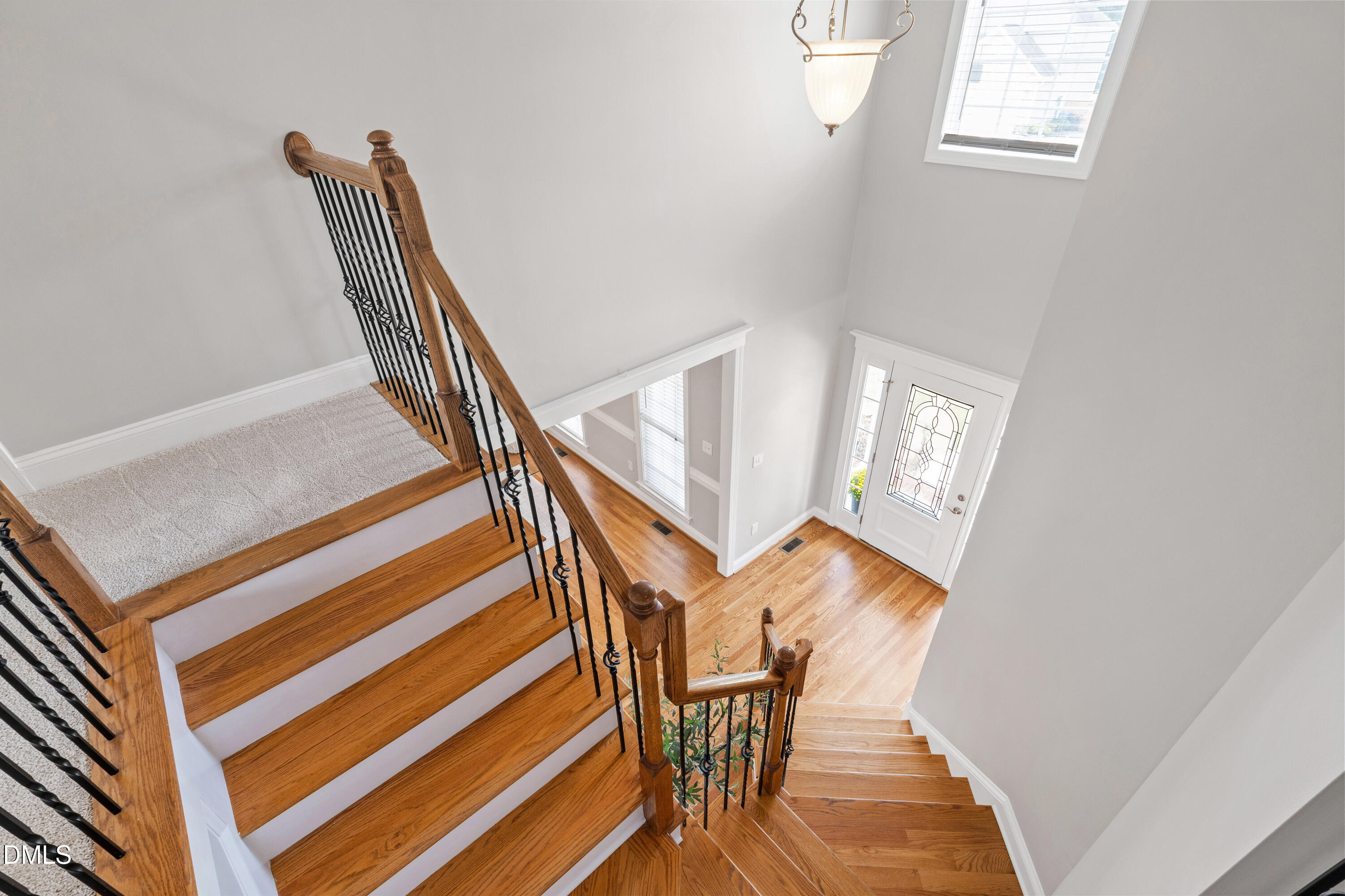 7753 Pegram Street Willow Spring, NC 27592 - Photo 28 of 54 a view of entryway and hall with wooden floor