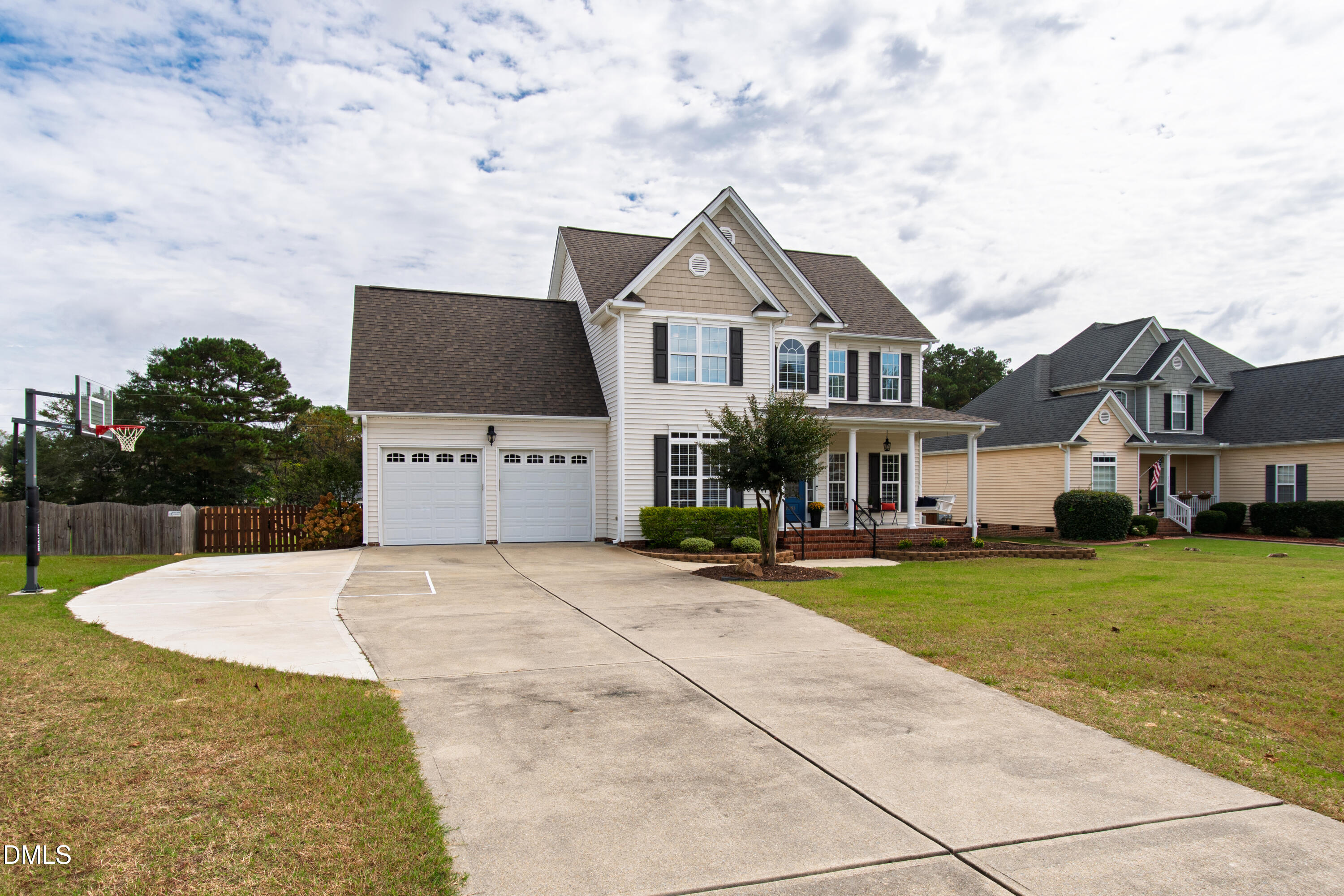 7753 Pegram Street Willow Spring, NC 27592 - Photo 3 of 54 a front view of house with yard and trees in the background