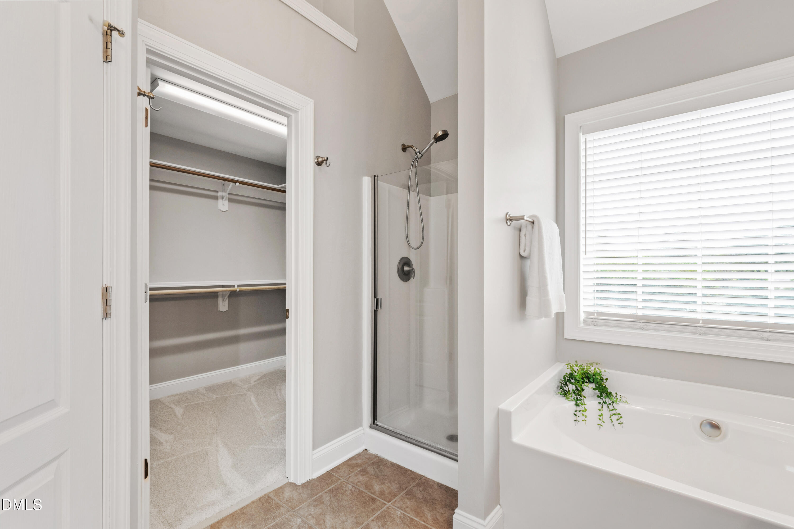 7753 Pegram Street Willow Spring, NC 27592 - Photo 32 of 54 a bathroom with a bathtub and shower
