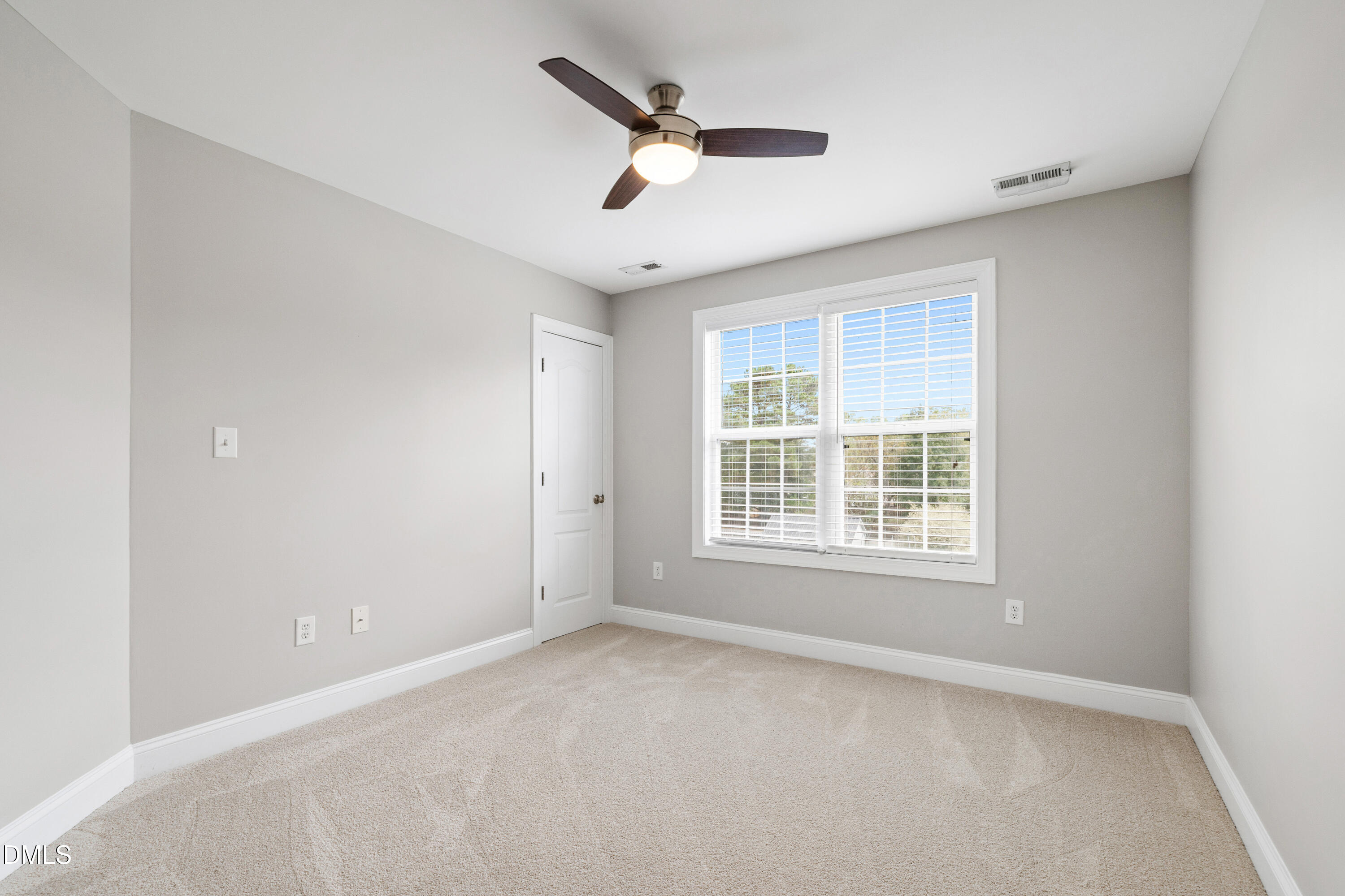 7753 Pegram Street Willow Spring, NC 27592 - Photo 35 of 54 a view of an empty room with a window