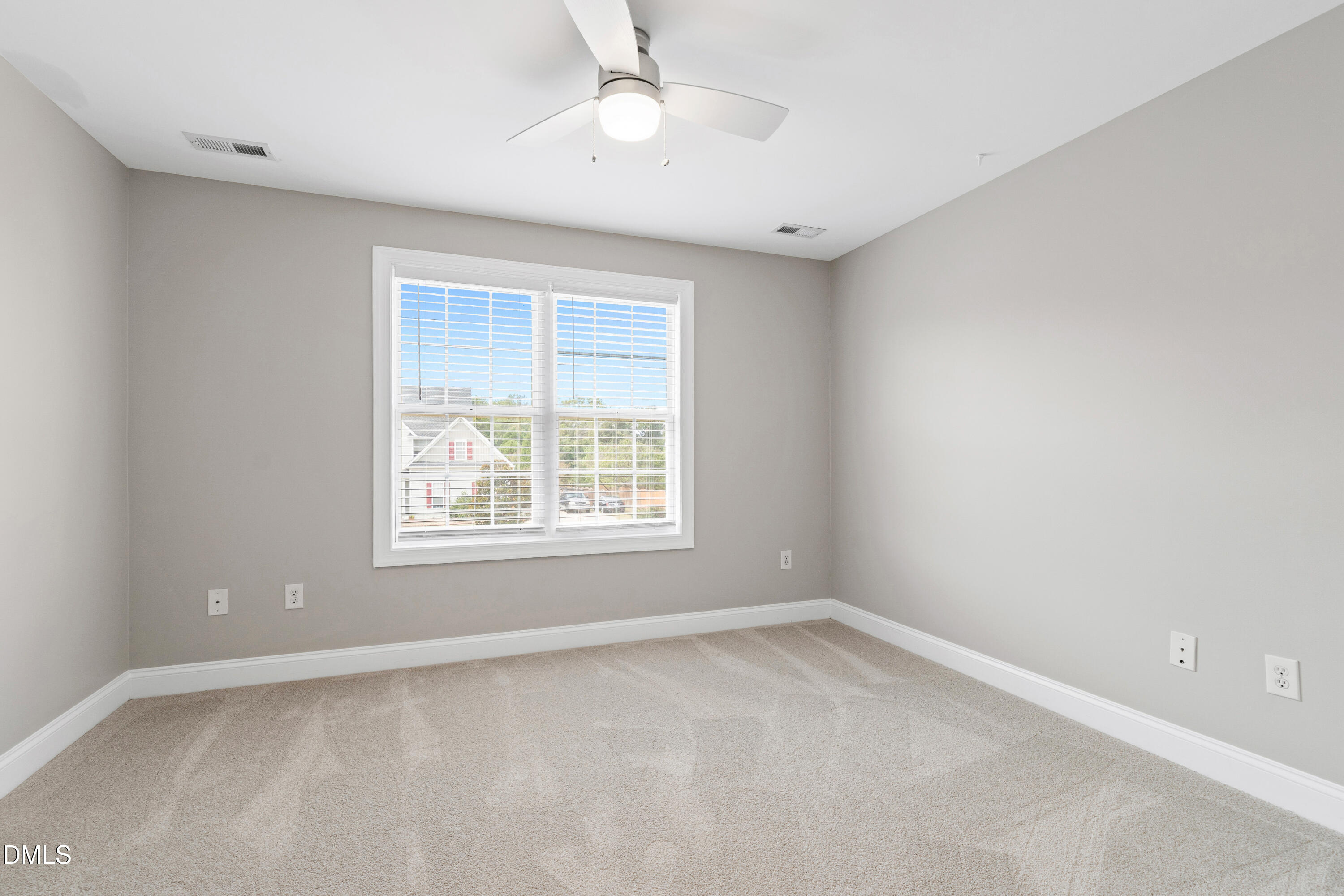 7753 Pegram Street Willow Spring, NC 27592 - Photo 40 of 54 an empty room with a window and a fan