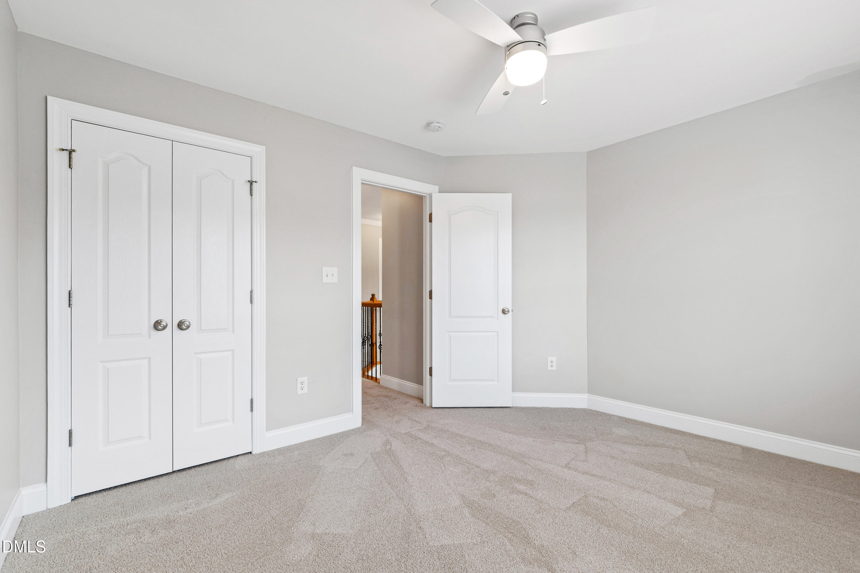 7753 Pegram Street Willow Spring, NC 27592 - Photo 41 of 54 a view of an empty room and chandelier fan