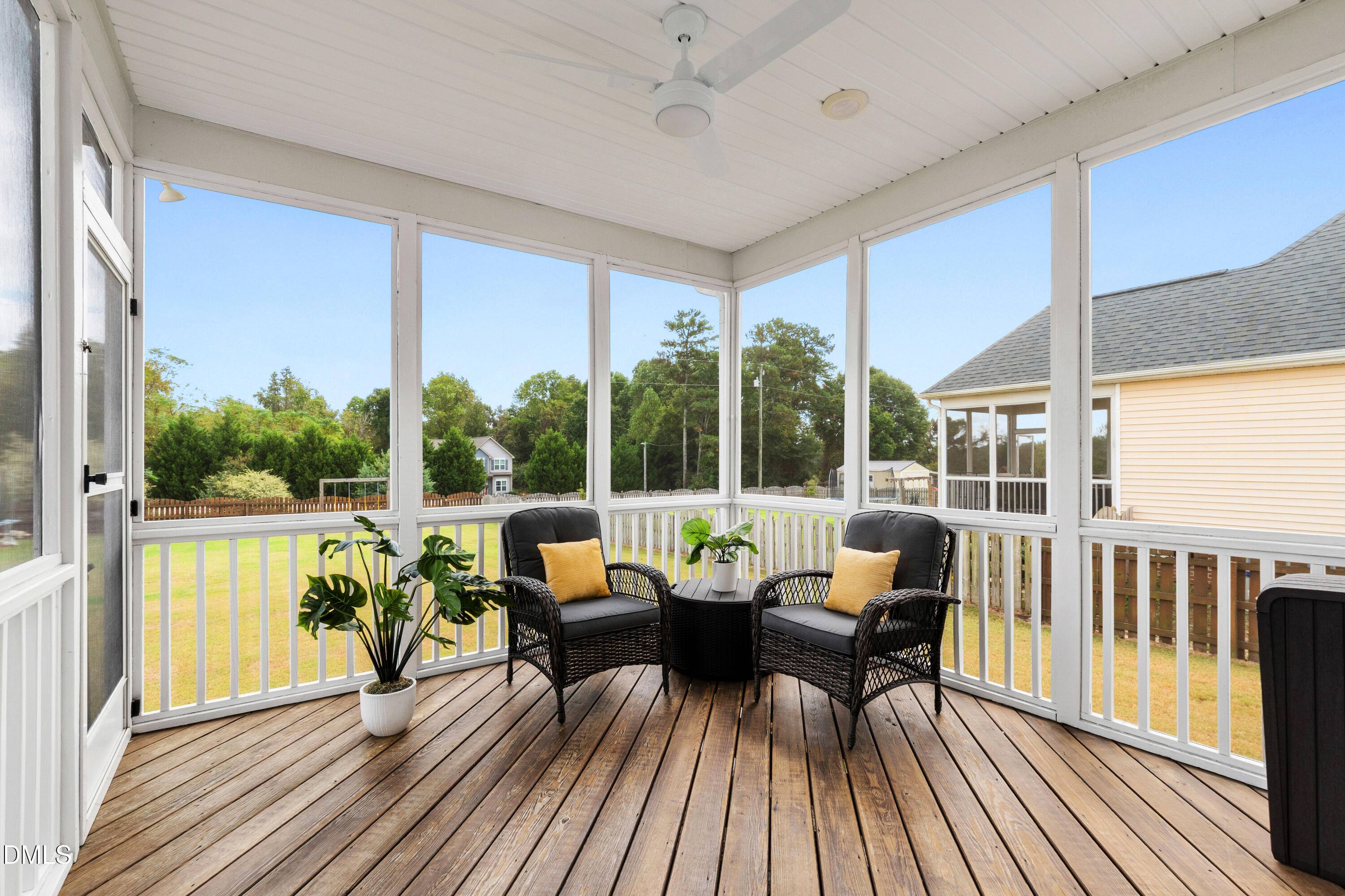 7753 Pegram Street Willow Spring, NC 27592 - Photo 46 of 54 a living room with large windows and furniture