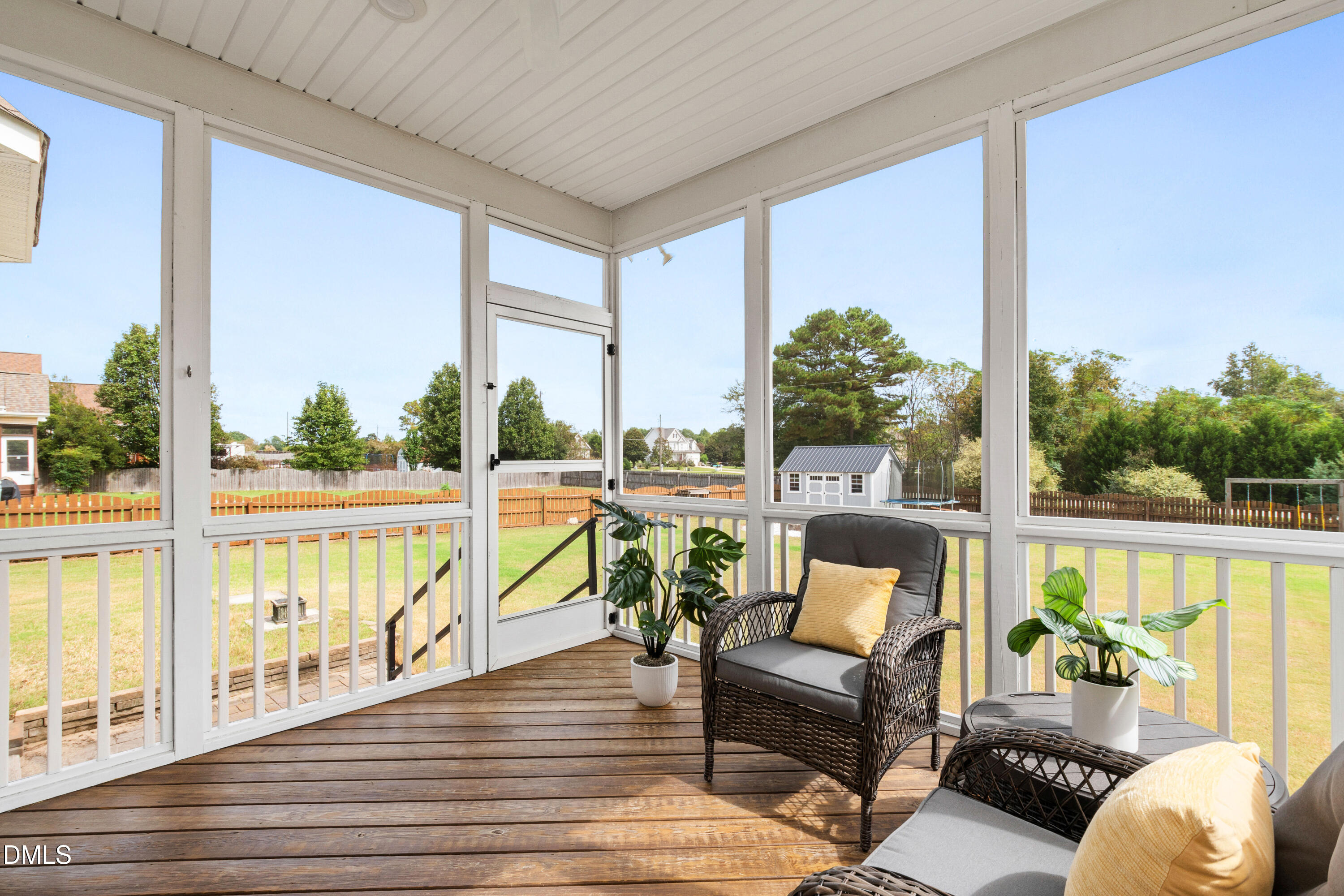 7753 Pegram Street Willow Spring, NC 27592 - Photo 47 of 54 a balcony with furniture and a potted plant