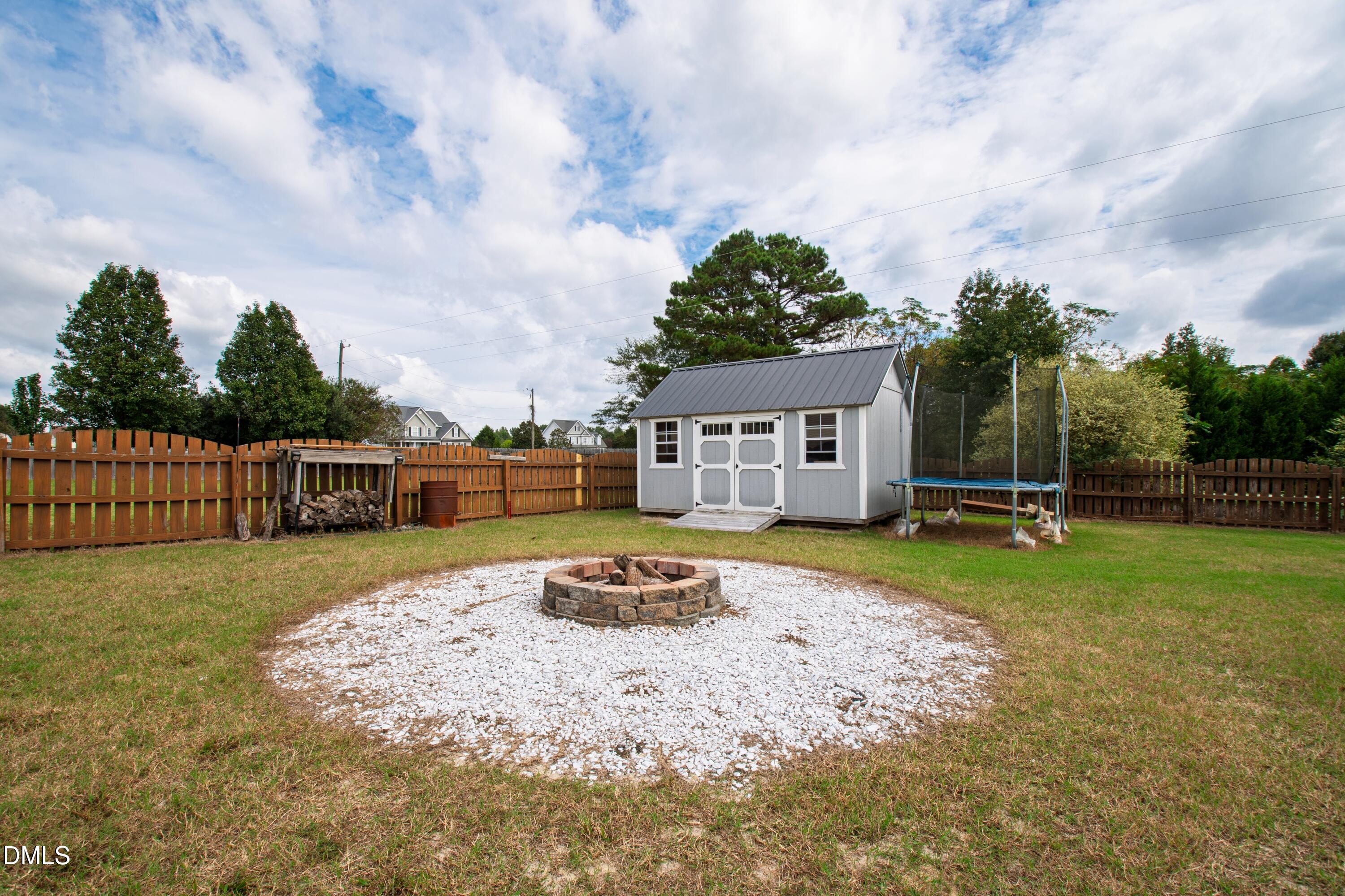 7753 Pegram Street Willow Spring, NC 27592 - Photo 53 of 54 a front view of a house with a yard