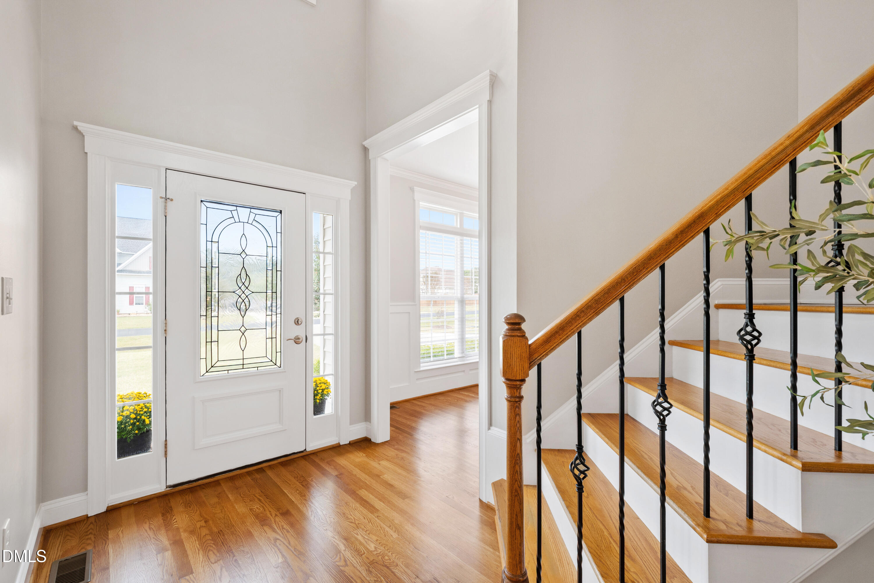 7753 Pegram Street Willow Spring, NC 27592 - Photo 7 of 54 a view of an entryway with wooden floor and door