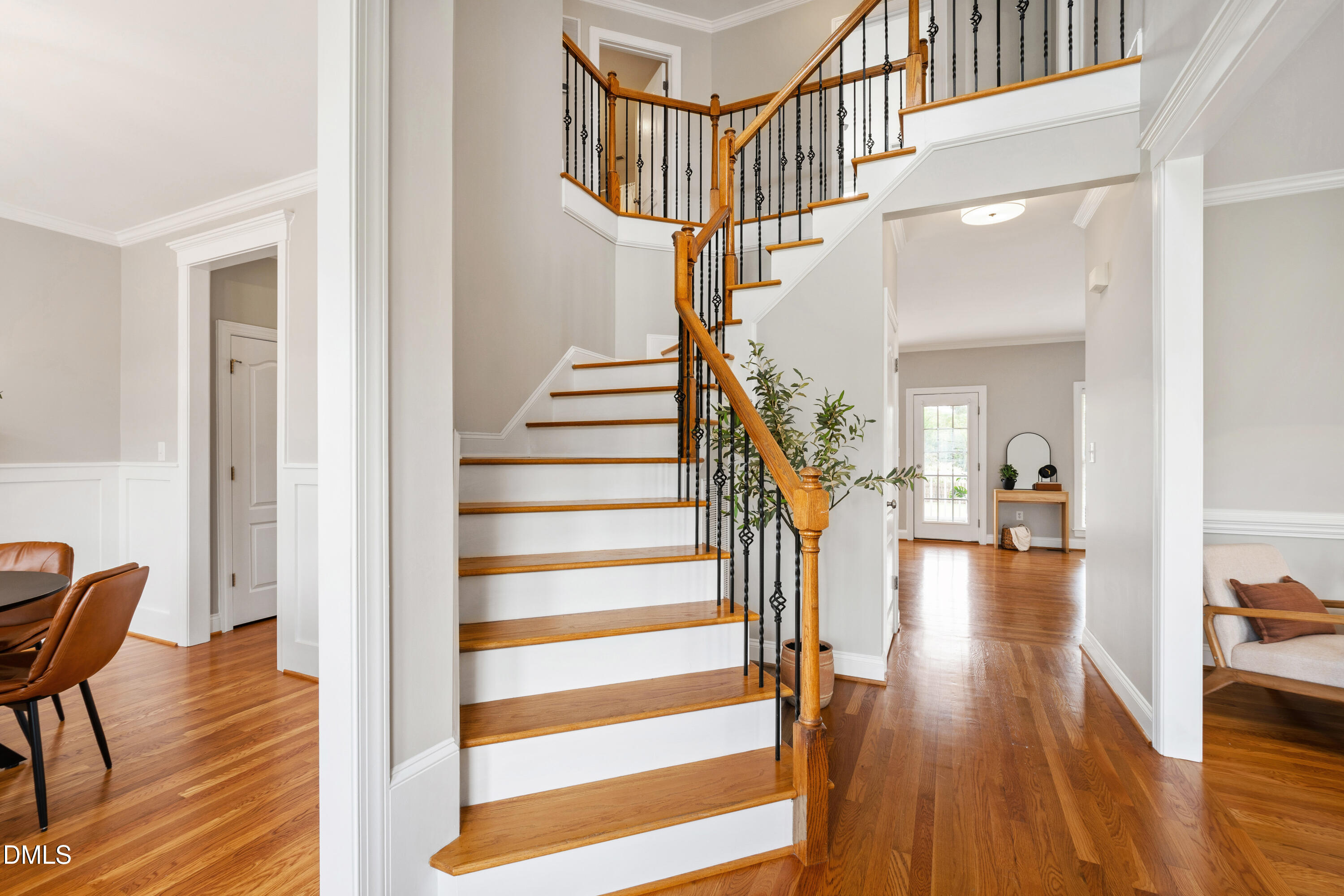 7753 Pegram Street Willow Spring, NC 27592 - Photo 8 of 54 a view of entryway and hall with wooden floor