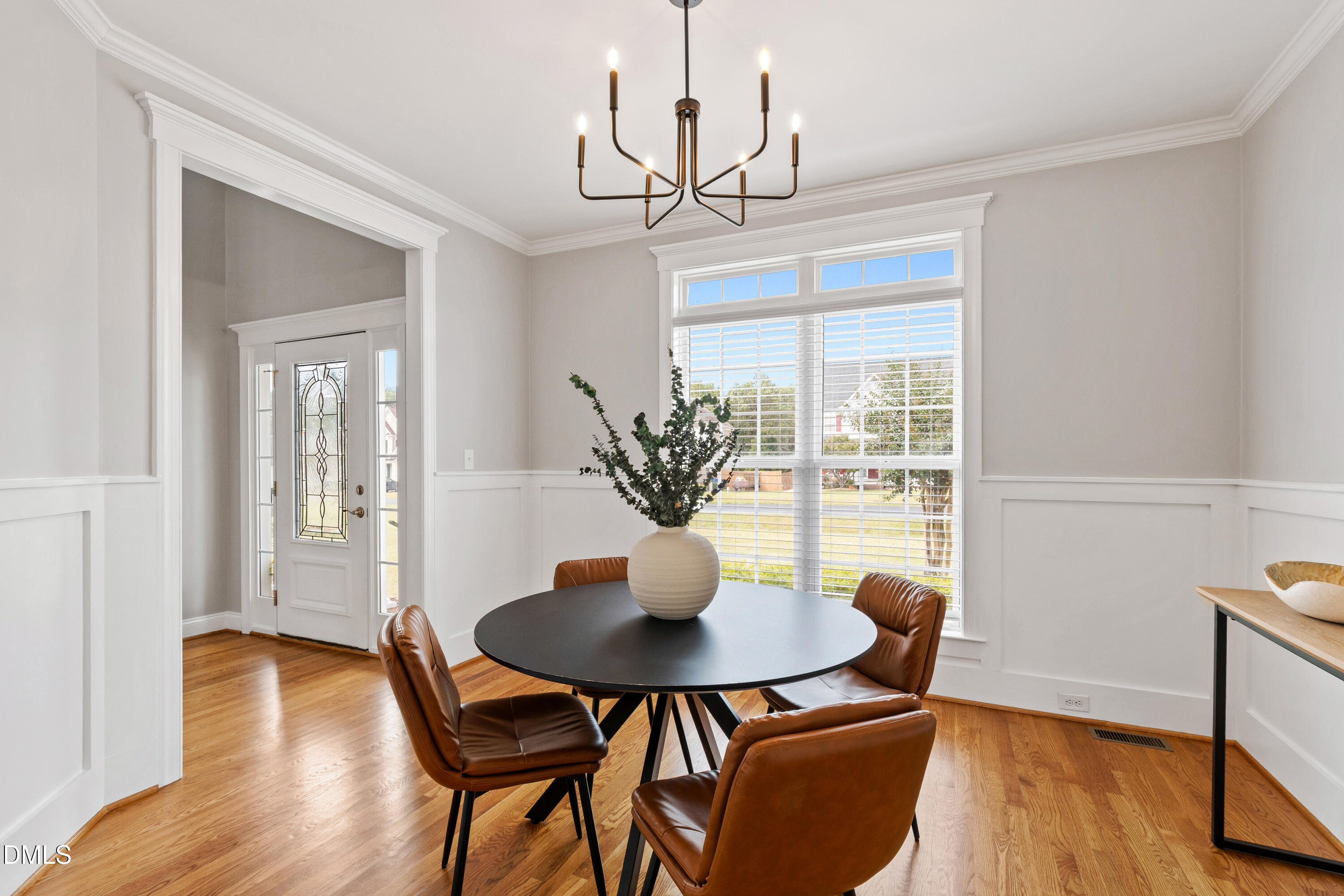 7753 Pegram Street Willow Spring, NC 27592 - Photo 9 of 54 a view of a dining room with furniture window and wooden floor