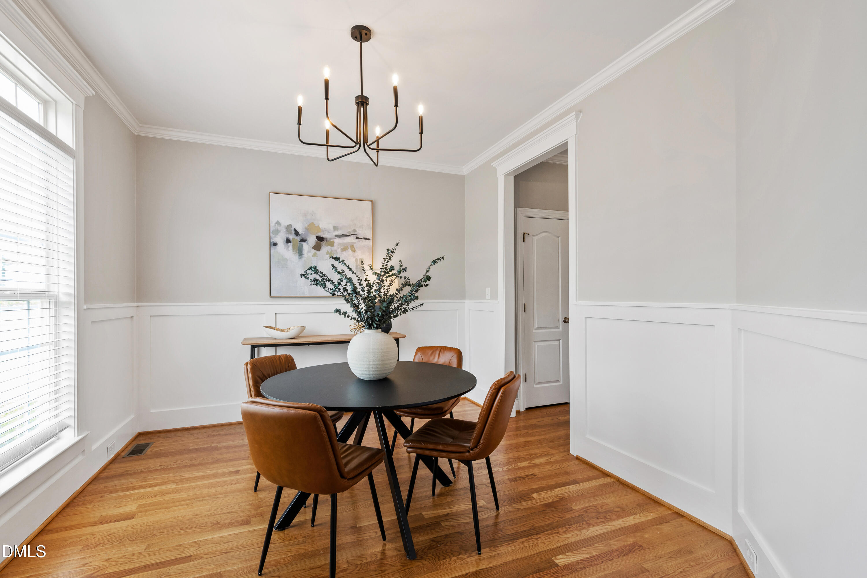 7753 Pegram Street Willow Spring, NC 27592 - Photo 10 of 54 a view of a dining room with furniture window and wooden floor