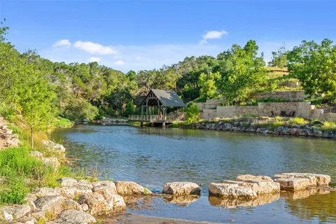 a view of a swimming pool with a yard