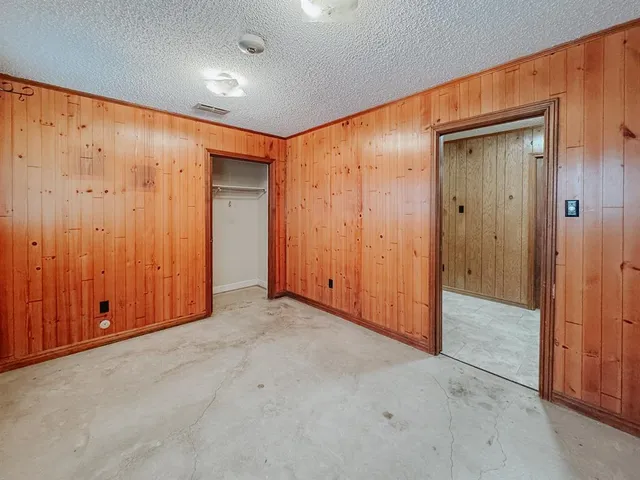 an empty room with a wooden door