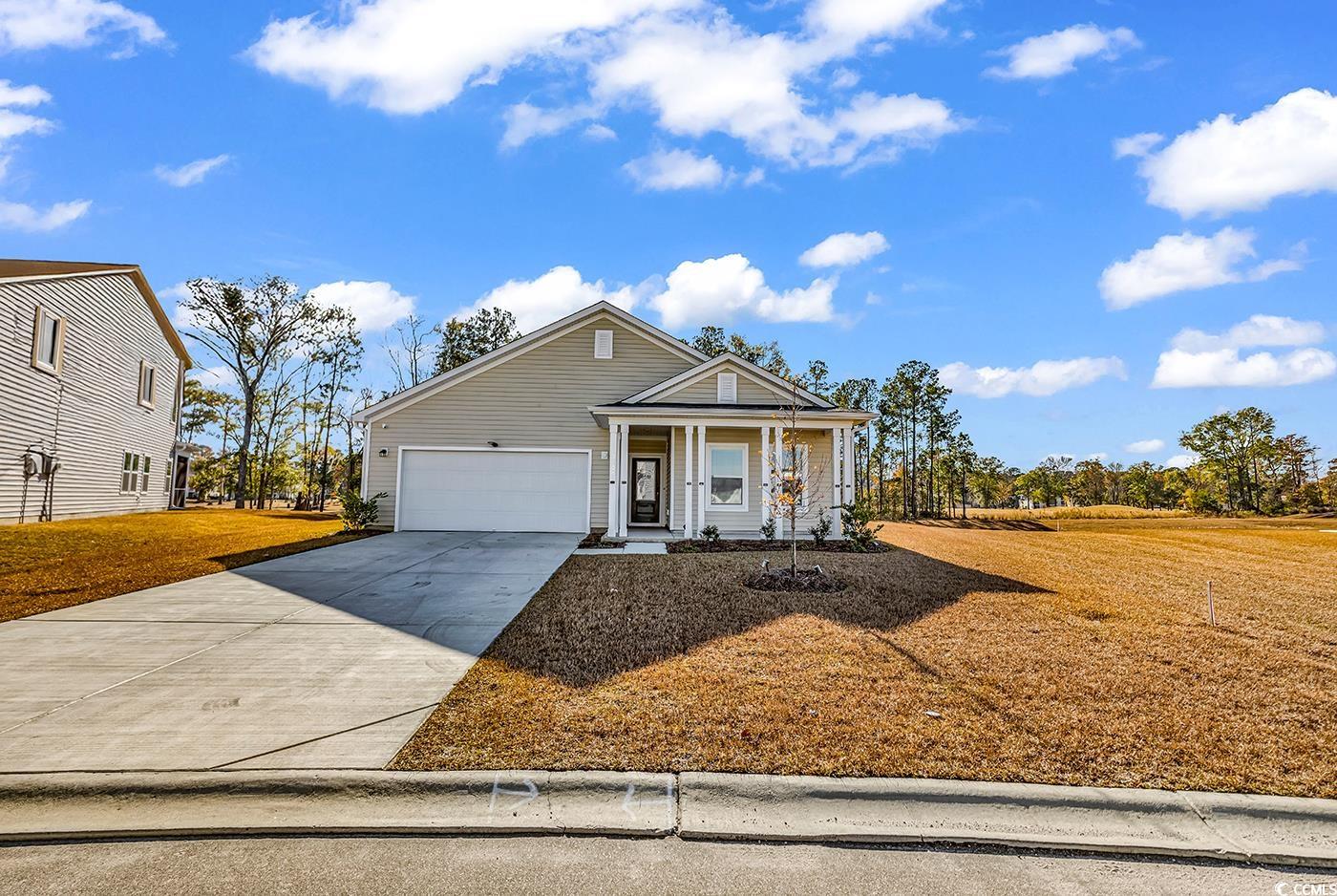 3104 Palma Way Myrtle Beach, SC 29579 - Photo 1 of 40 View of front of home featuring covered porch and concrete driveway