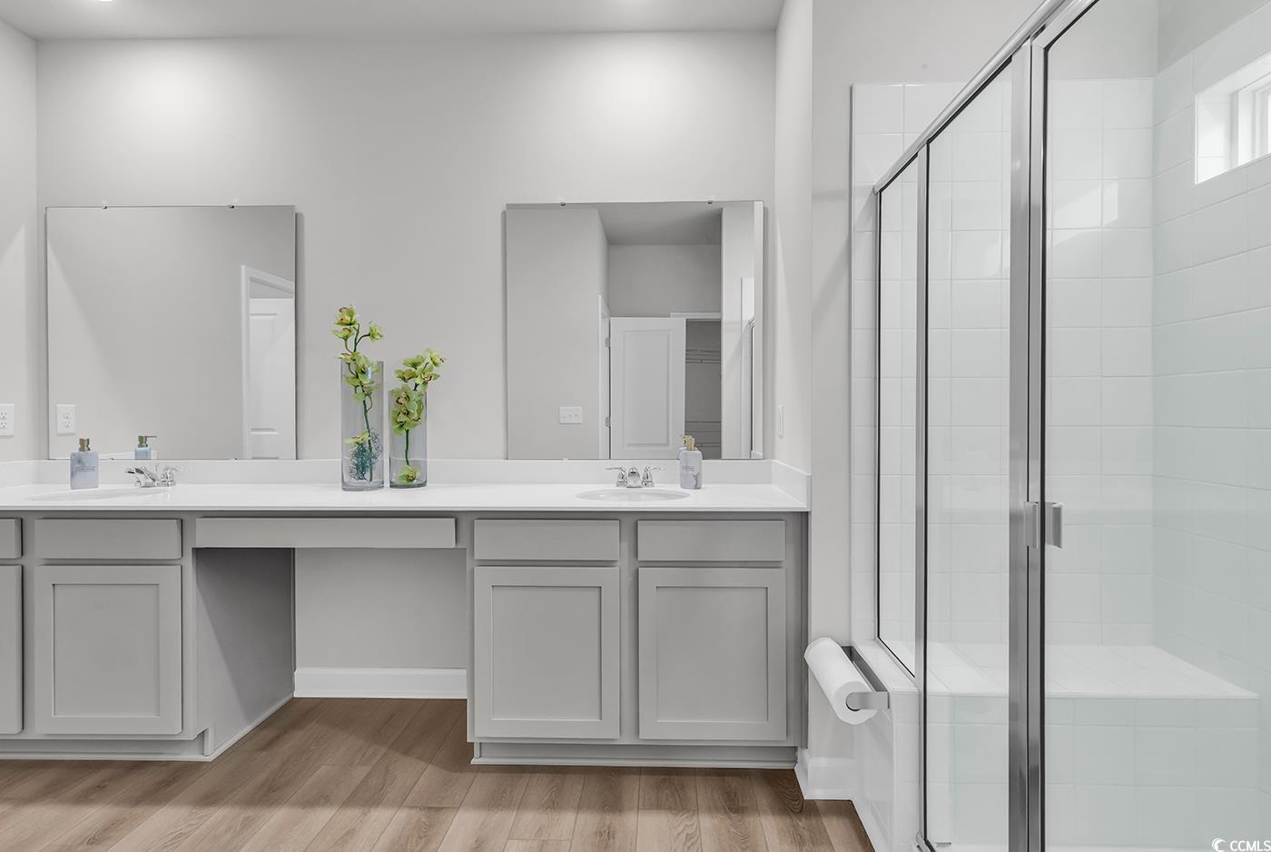 3104 Palma Way Myrtle Beach, SC 29579 - Photo 26 of 40 Full bathroom featuring double vanity, a stall shower, and light wood finished floors