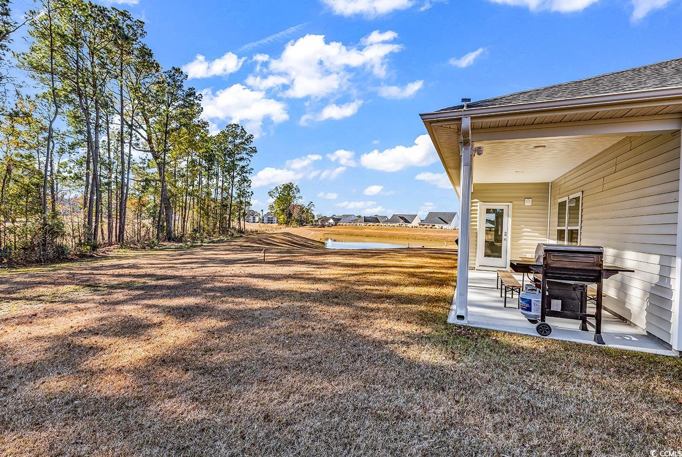 3104 Palma Way Myrtle Beach, SC 29579 - Photo 32 of 40 View of yard featuring a patio and a residential view