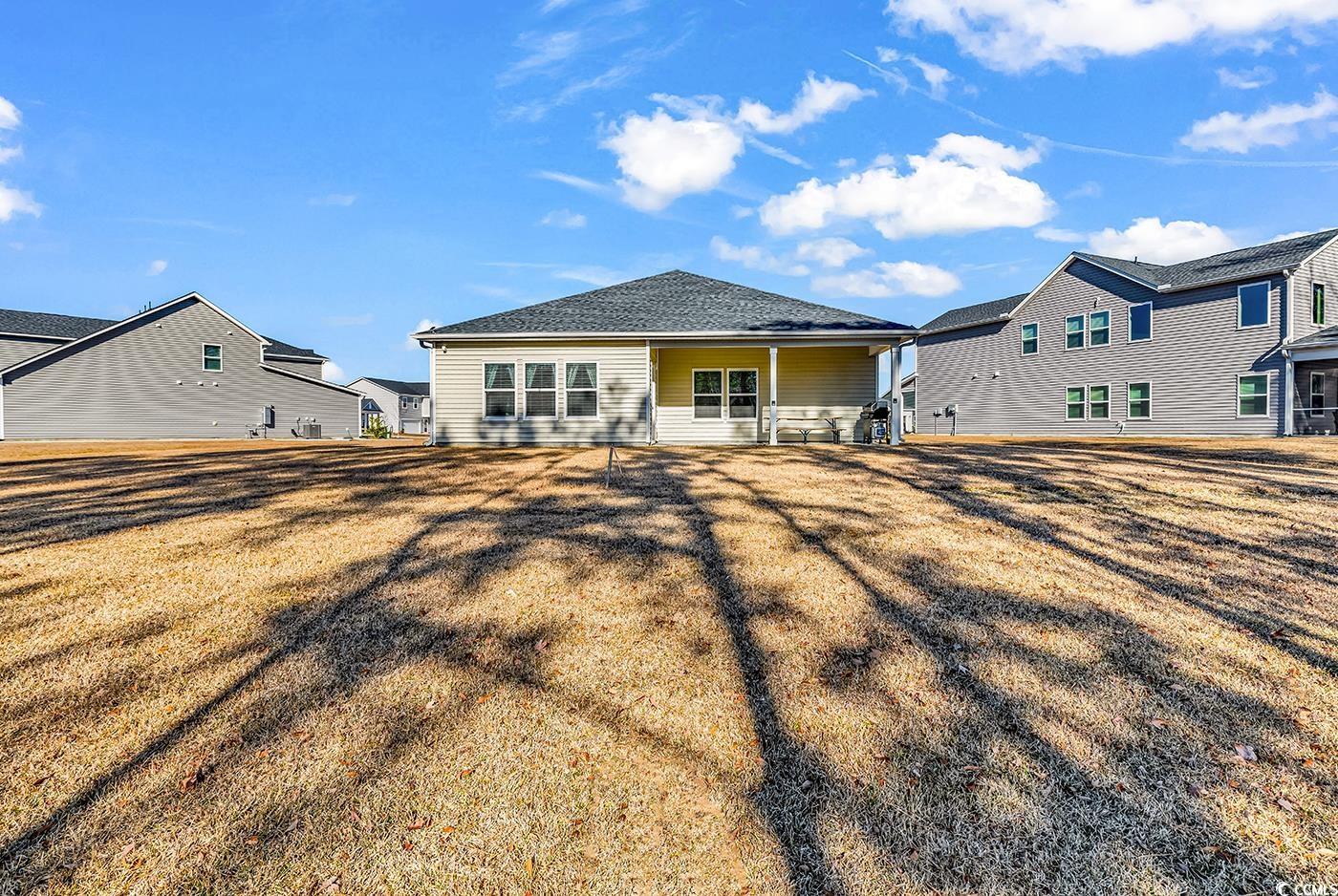 3104 Palma Way Myrtle Beach, SC 29579 - Photo 34 of 40 Back of house featuring a patio and a yard