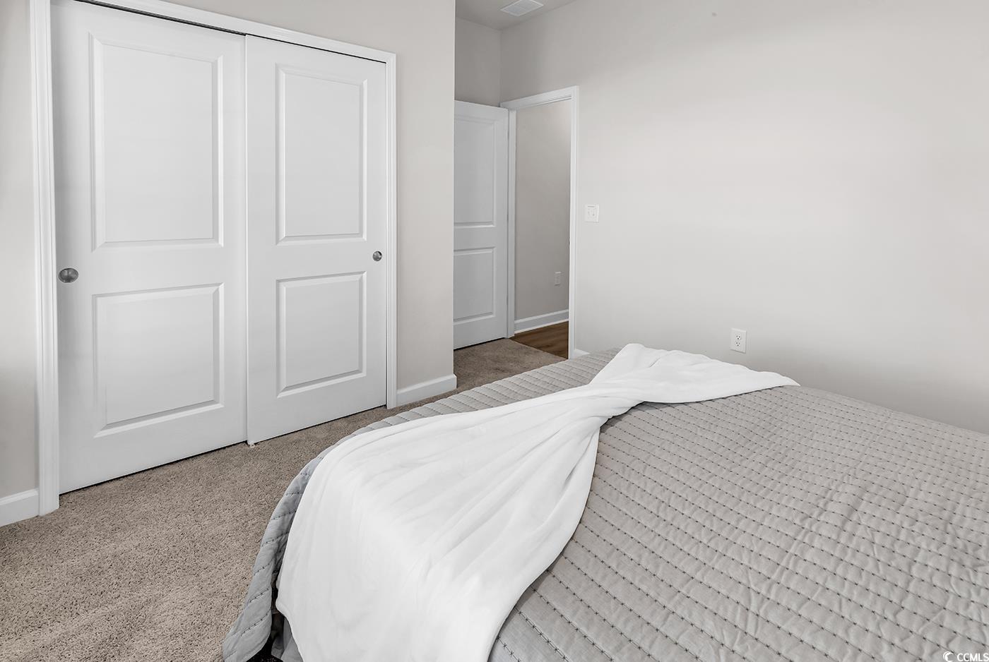 3104 Palma Way Myrtle Beach, SC 29579 - Photo 5 of 40 Carpeted bedroom with a closet and baseboards