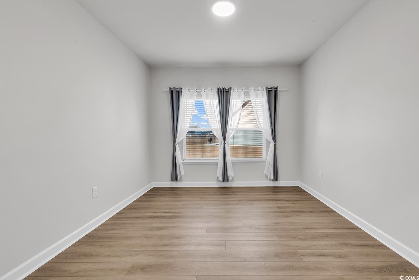 3104 Palma Way Myrtle Beach, SC 29579 - Photo 7 of 40 Spare room featuring light wood finished floors and baseboards