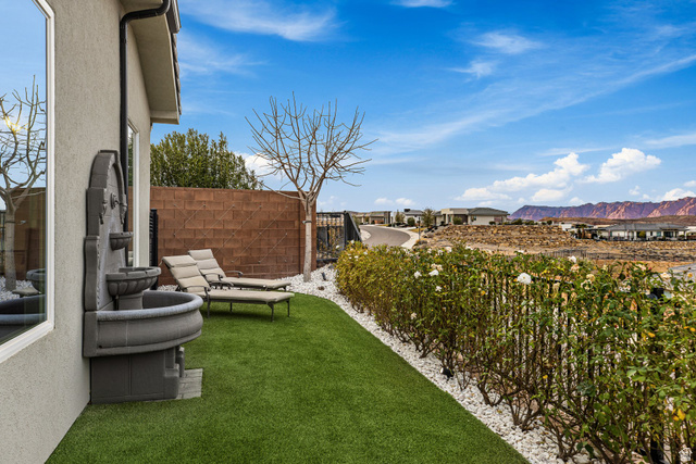 3022 West Sesia Way St. George, UT 84770 - Photo 37 of 52 View of yard with a mountain view and a patio area