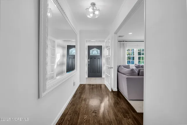 a view of gallery with wooden floor