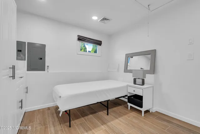 a backyard of a house with table and chairs