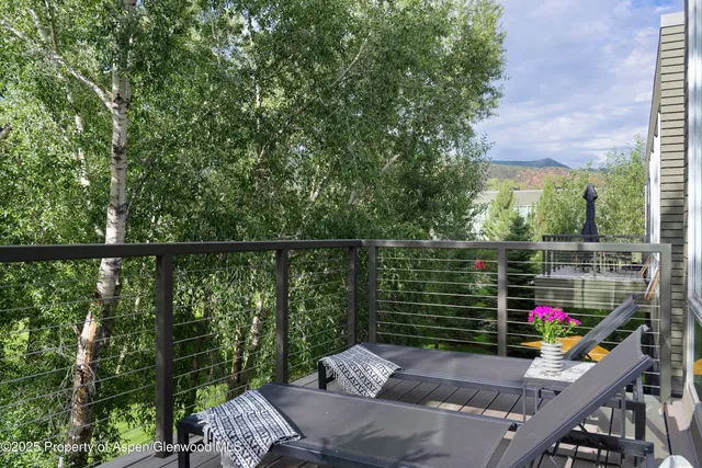 a balcony with chairs